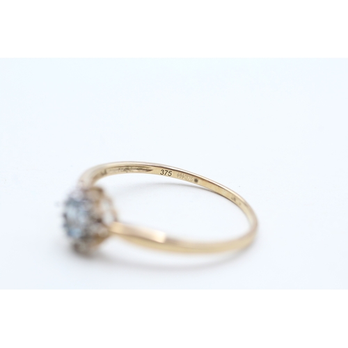 184 - 9ct gold blue topaz & diamond cluster ring (0.8g) Size V