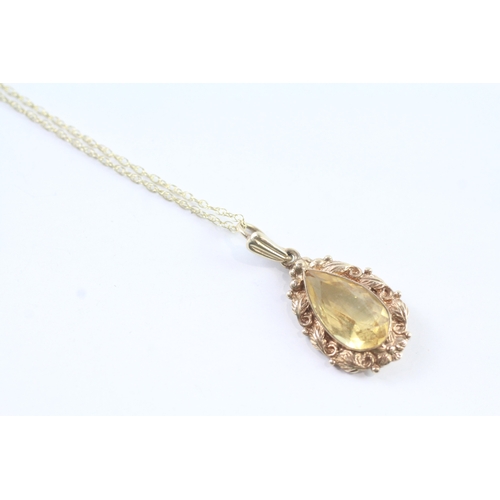 190 - 9ct gold vintage pear cut citrine with a foliate patterned border pendant necklace (3.4g)