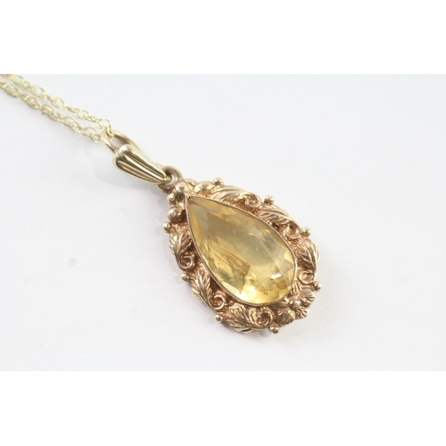 190 - 9ct gold vintage pear cut citrine with a foliate patterned border pendant necklace (3.4g)