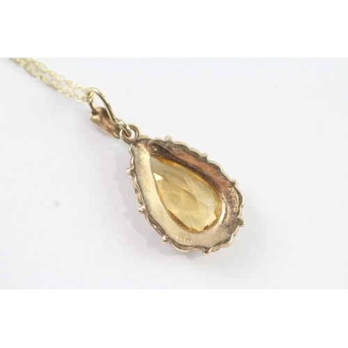 190 - 9ct gold vintage pear cut citrine with a foliate patterned border pendant necklace (3.4g)