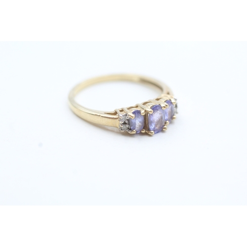 209 - 9ct gold diamond and tanzanite trilogy ring (2.6g) Size R