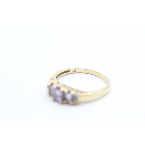 209 - 9ct gold diamond and tanzanite trilogy ring (2.6g) Size R