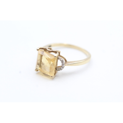 212 - 9ct gold yellow gemstone & diamond dress ring (3g) Size R 1/2