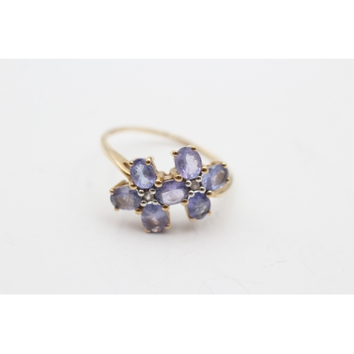 230 - 9ct gold tanzanite & white gemstone floral dress ring (2.8g) Size T 1/2