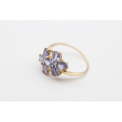 230 - 9ct gold tanzanite & white gemstone floral dress ring (2.8g) Size T 1/2