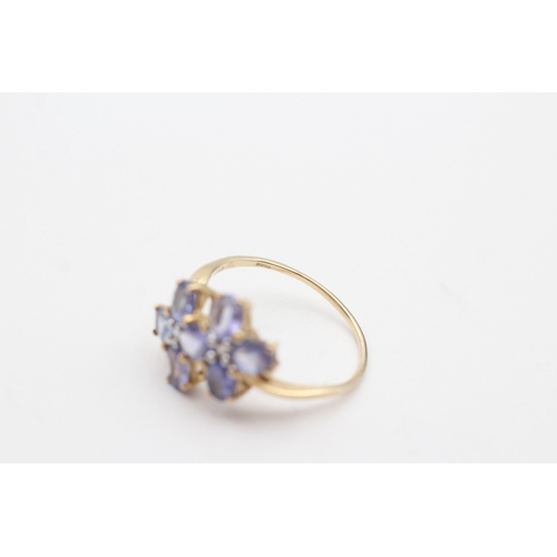 230 - 9ct gold tanzanite & white gemstone floral dress ring (2.8g) Size T 1/2