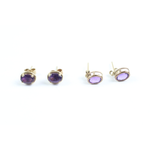 233 - 2x 9ct gold amethyst stud earrings