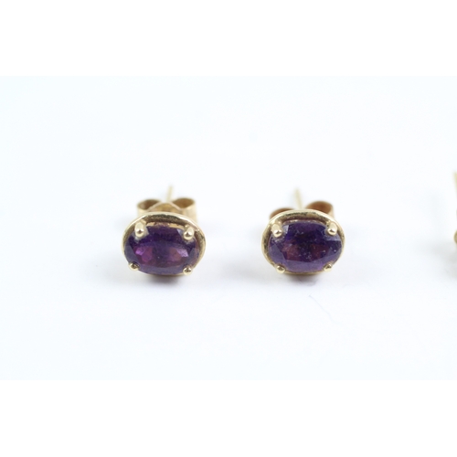 233 - 2x 9ct gold amethyst stud earrings