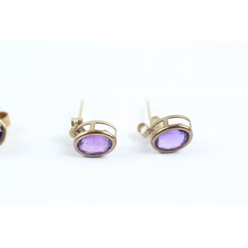 233 - 2x 9ct gold amethyst stud earrings