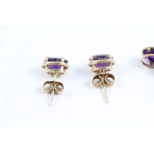 233 - 2x 9ct gold amethyst stud earrings