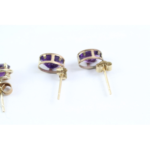 233 - 2x 9ct gold amethyst stud earrings