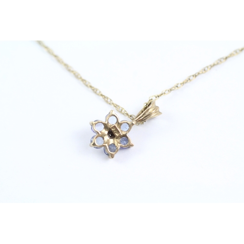 30 - 9ct gold diamond and tanzanite flower pendant on chain Size O