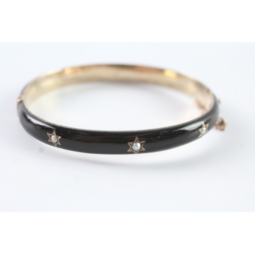 72 - 9ct gold Victorian enamel and seed pearl mourning bangle