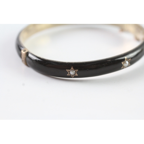 72 - 9ct gold Victorian enamel and seed pearl mourning bangle