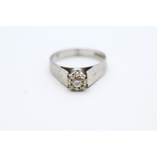 80 - 9ct white gold diamond solitaire ring with patterned shoulders (2.7g) Size L 1/2