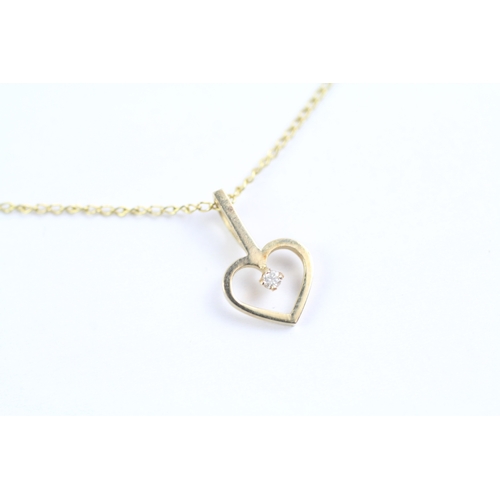 95 - 9ct gold diamond heart pendant on chain