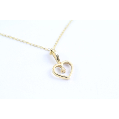 95 - 9ct gold diamond heart pendant on chain