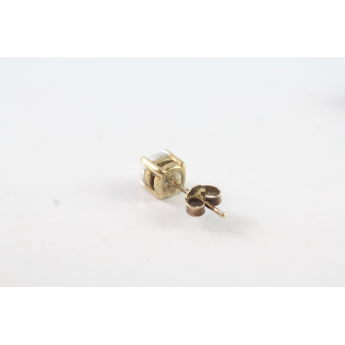 131 - 9ct gold diamond stud earrings