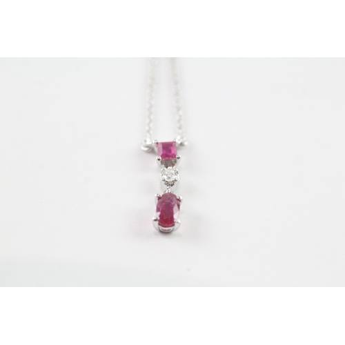 147 - 18ct white gold ruby and diamond pendant w/ 18ct white gold chain