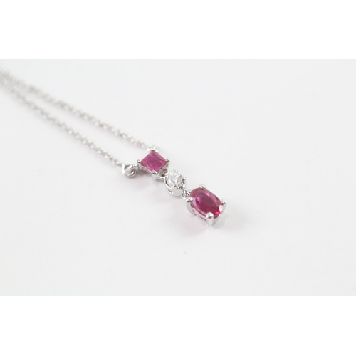 147 - 18ct white gold ruby and diamond pendant w/ 18ct white gold chain