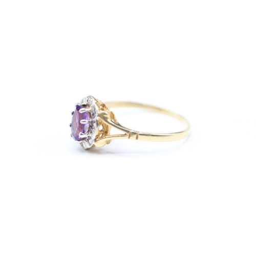 176 - 9ct gold amethyst and diamond halo set ring (1.4g) Size M