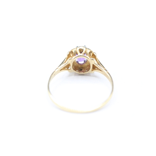 176 - 9ct gold amethyst and diamond halo set ring (1.4g) Size M