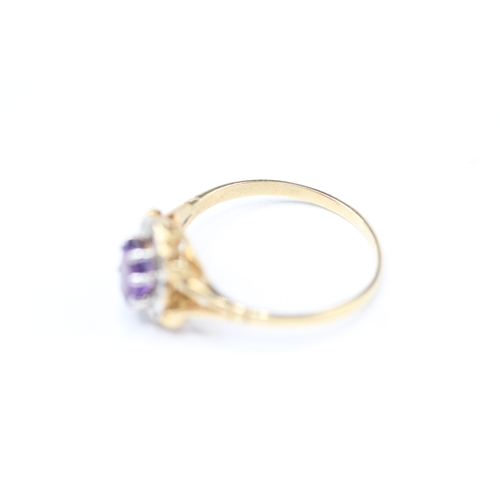 176 - 9ct gold amethyst and diamond halo set ring (1.4g) Size M