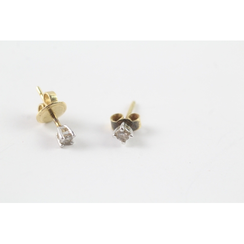 201 - 18ct gold single diamond stud earrings