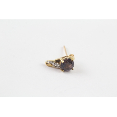 210 - 9ct gold purple gemstone and diamond stud earrings