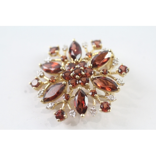 214 - 9ct gold garnet and diamond floral brooch