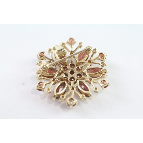 214 - 9ct gold garnet and diamond floral brooch