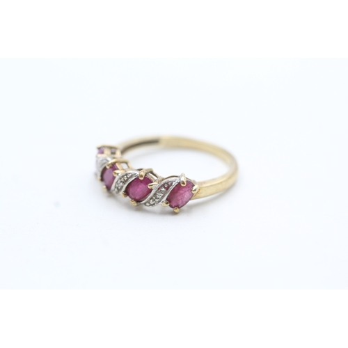 222 - 9ct gold ruby and diamond twist ring (1.9g) Size M