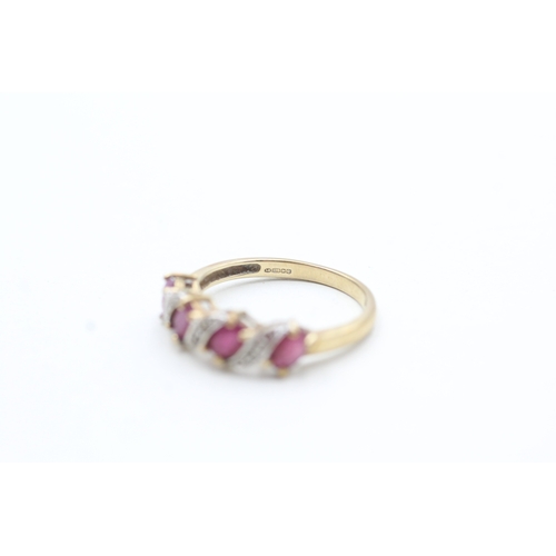 222 - 9ct gold ruby and diamond twist ring (1.9g) Size M