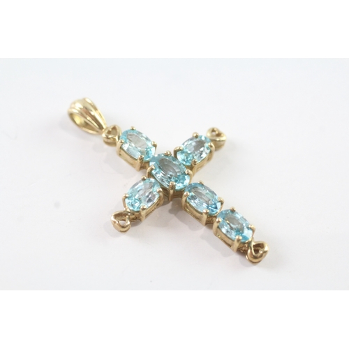 48 - 9ct gold topaz set cross pendant