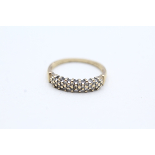 65 - 9ct gold diamond eternity ring (1.7g) Size M