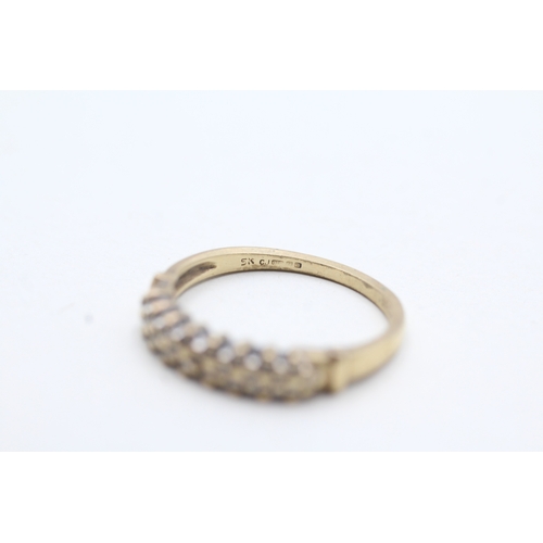 65 - 9ct gold diamond eternity ring (1.7g) Size M