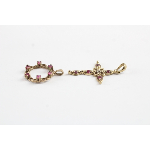 69 - 2x 9ct gold ruby & diamond wreath & cross pendants