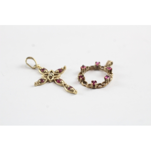 69 - 2x 9ct gold ruby & diamond wreath & cross pendants