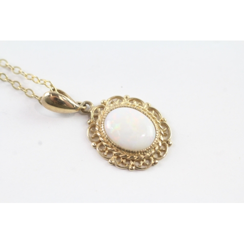 81 - 9ct gold opal framed pendant on chain (3.4g)