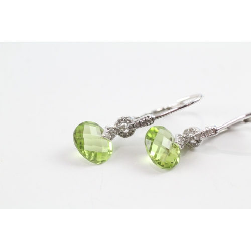 92 - 9ct white gold peridot and diamond drop earrings w/ hinged backs