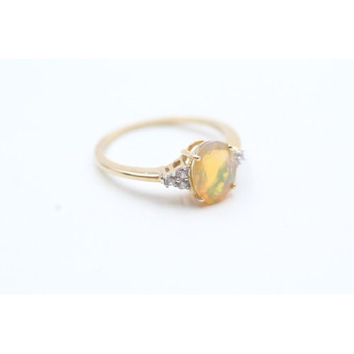 103 - 9ct gold opal and zircon framed ring (1.7g) Size O