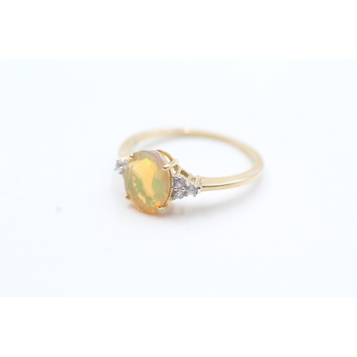 103 - 9ct gold opal and zircon framed ring (1.7g) Size O