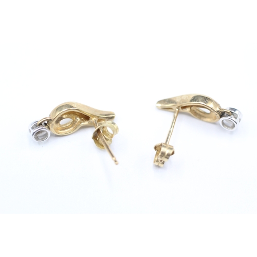 104 - 9ct gold and diamond stud earrings (1.5g)