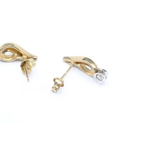 104 - 9ct gold and diamond stud earrings (1.5g)