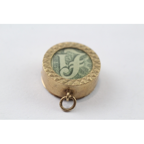 106 - 9ct gold vintage money note charm