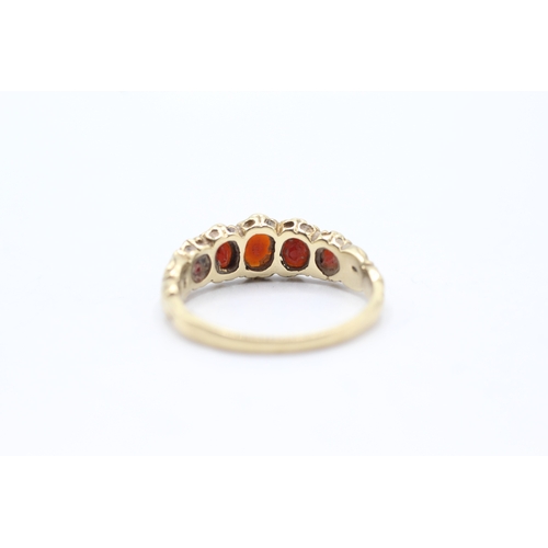 115 - 9ct gold five stone garnet ring (2.7g) Size P 1/2