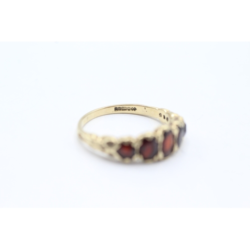 115 - 9ct gold five stone garnet ring (2.7g) Size P 1/2