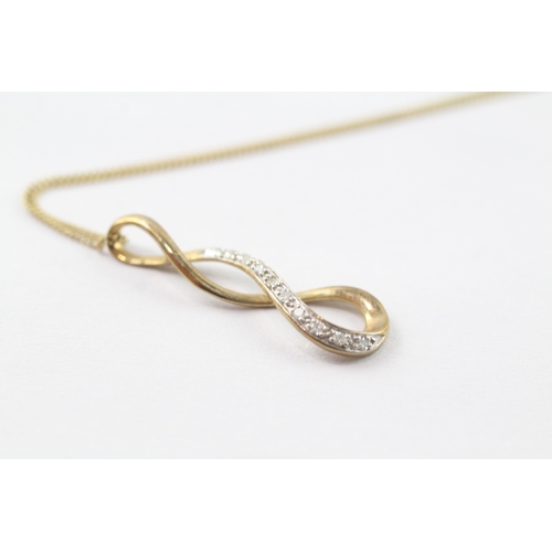 123 - 9ct gold diamond twist pendant on chain (1.4g)