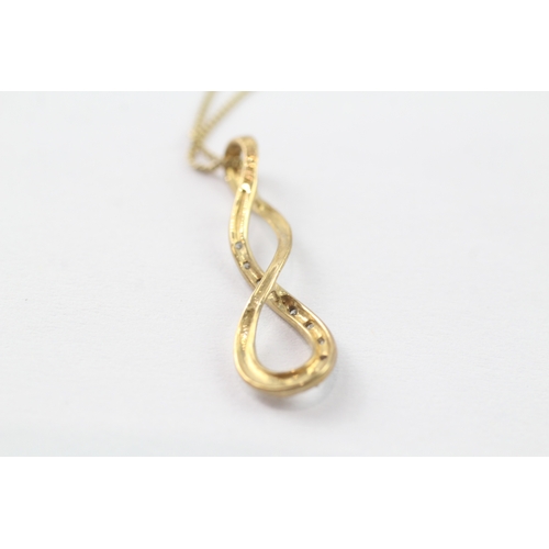 123 - 9ct gold diamond twist pendant on chain (1.4g)