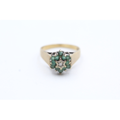 125 - 9ct gold emerald and diamond halo ring (2.8g) Size O